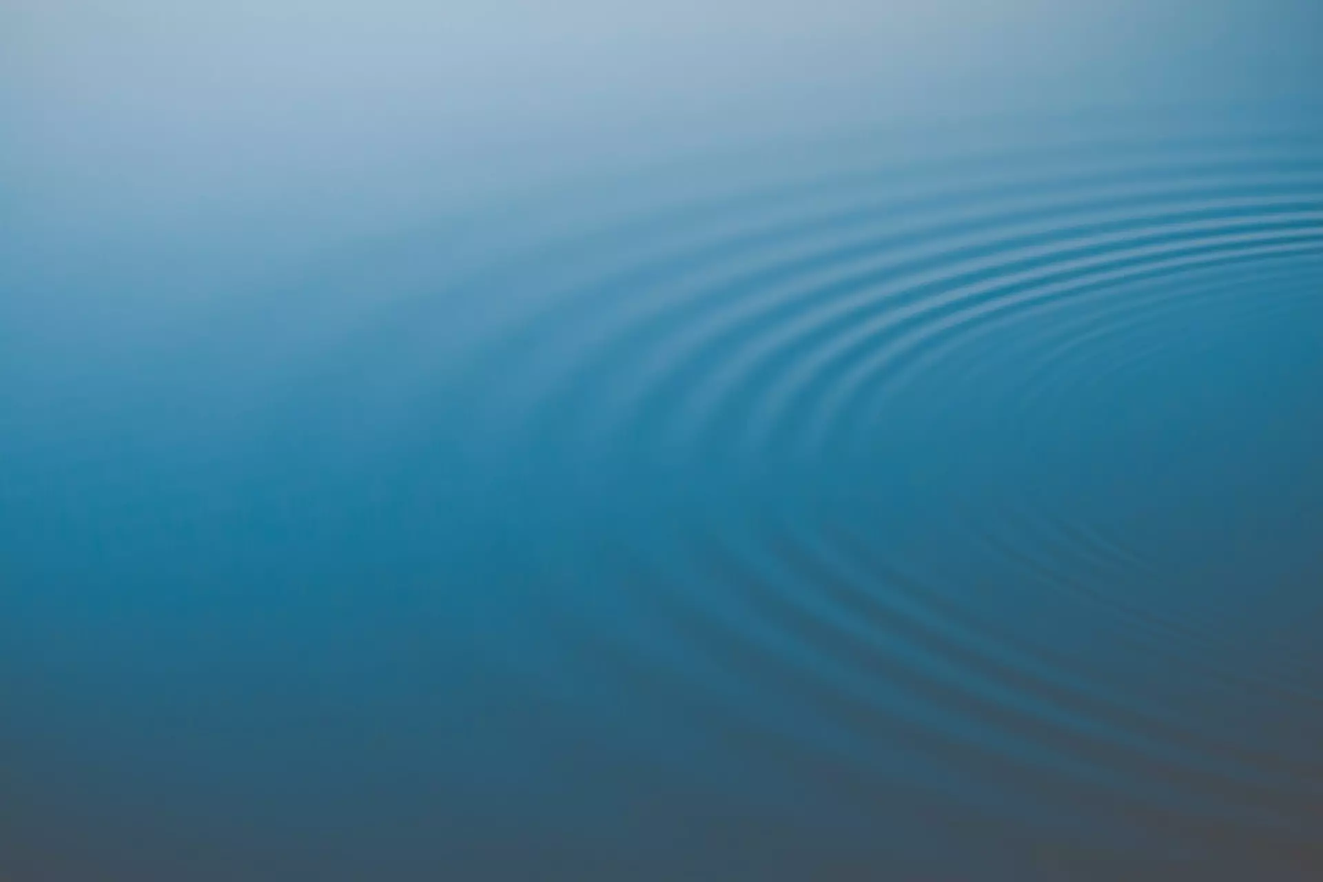 Circular ripples spreading across a water surface.