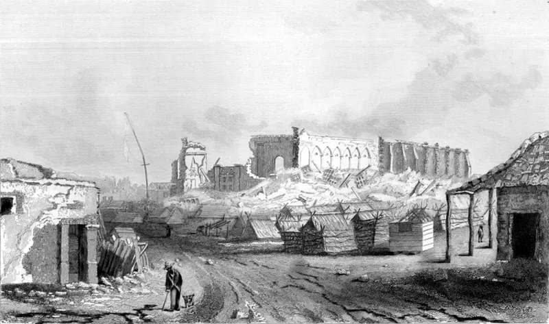 Engraving of the ruined Concepción Cathedral after the 1835 earthquake, its stone walls partially collapsed with rubble below, makeshift wooden shelters lining the muddy street in the foreground, and a solitary figure with a dog
