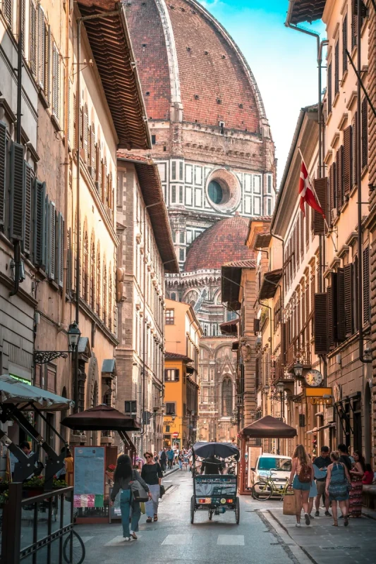 A view of Florence's Duomo, seen from a small street.